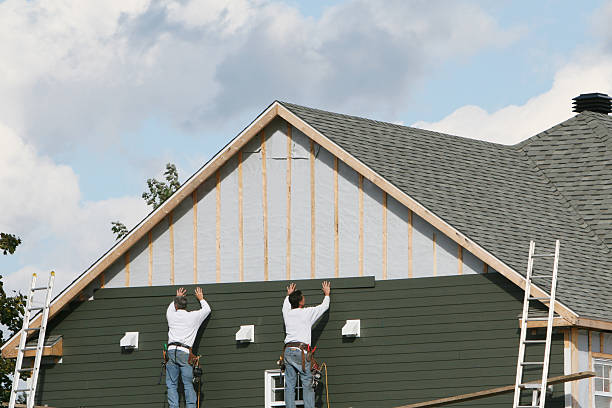 Professional Storm Damage Siding Repair technician working in Wellington, CO